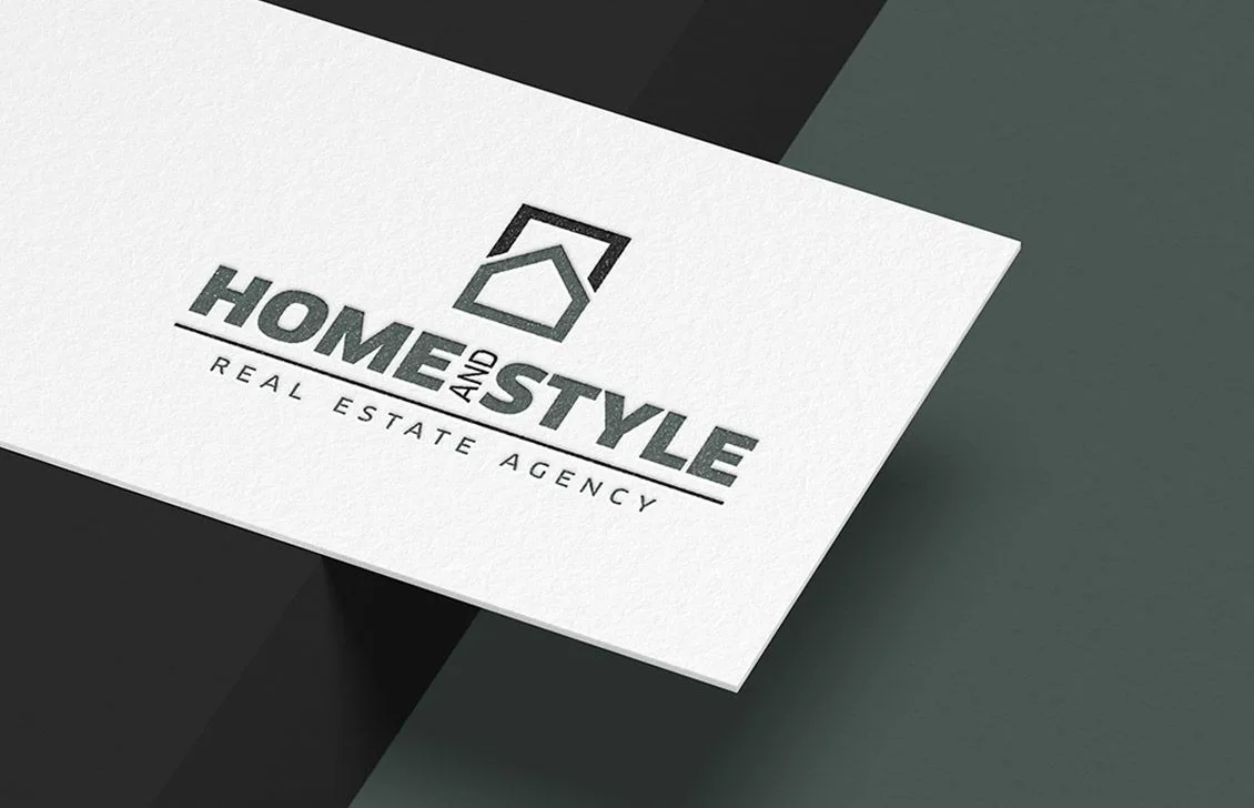 Logotipo de Home and Style Real Estate Agency sobre papel texturizado
