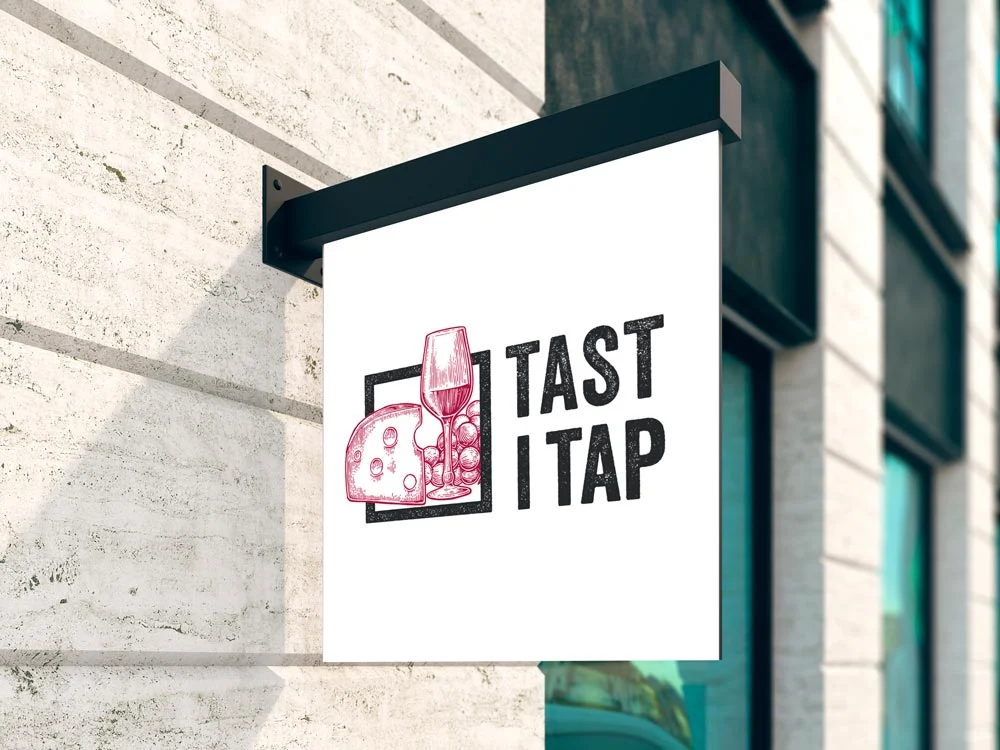Banderola con el logotipo de Tast i Tap en la fachada del local